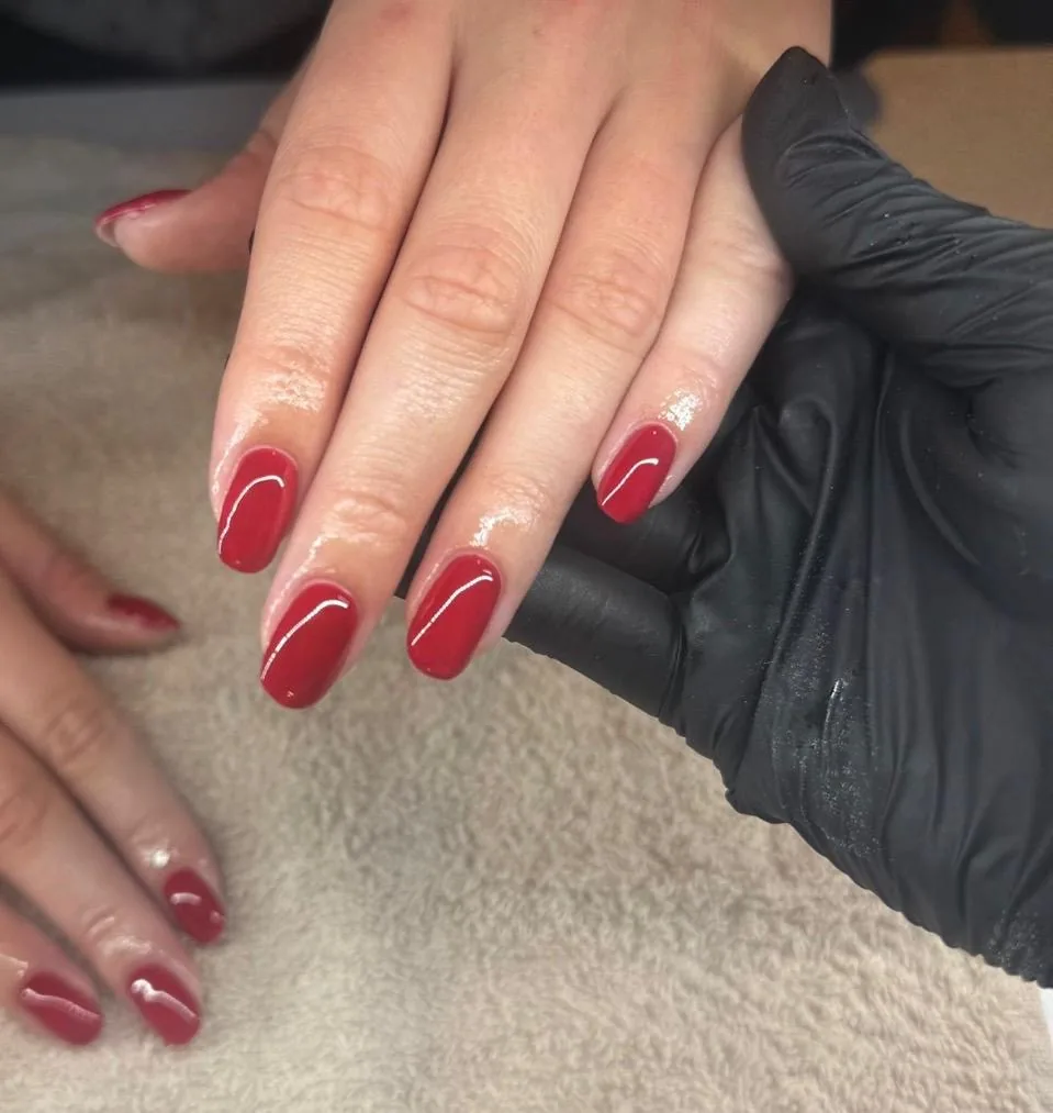 Deep red BIAB manicure freshly applied at Glam & Glow