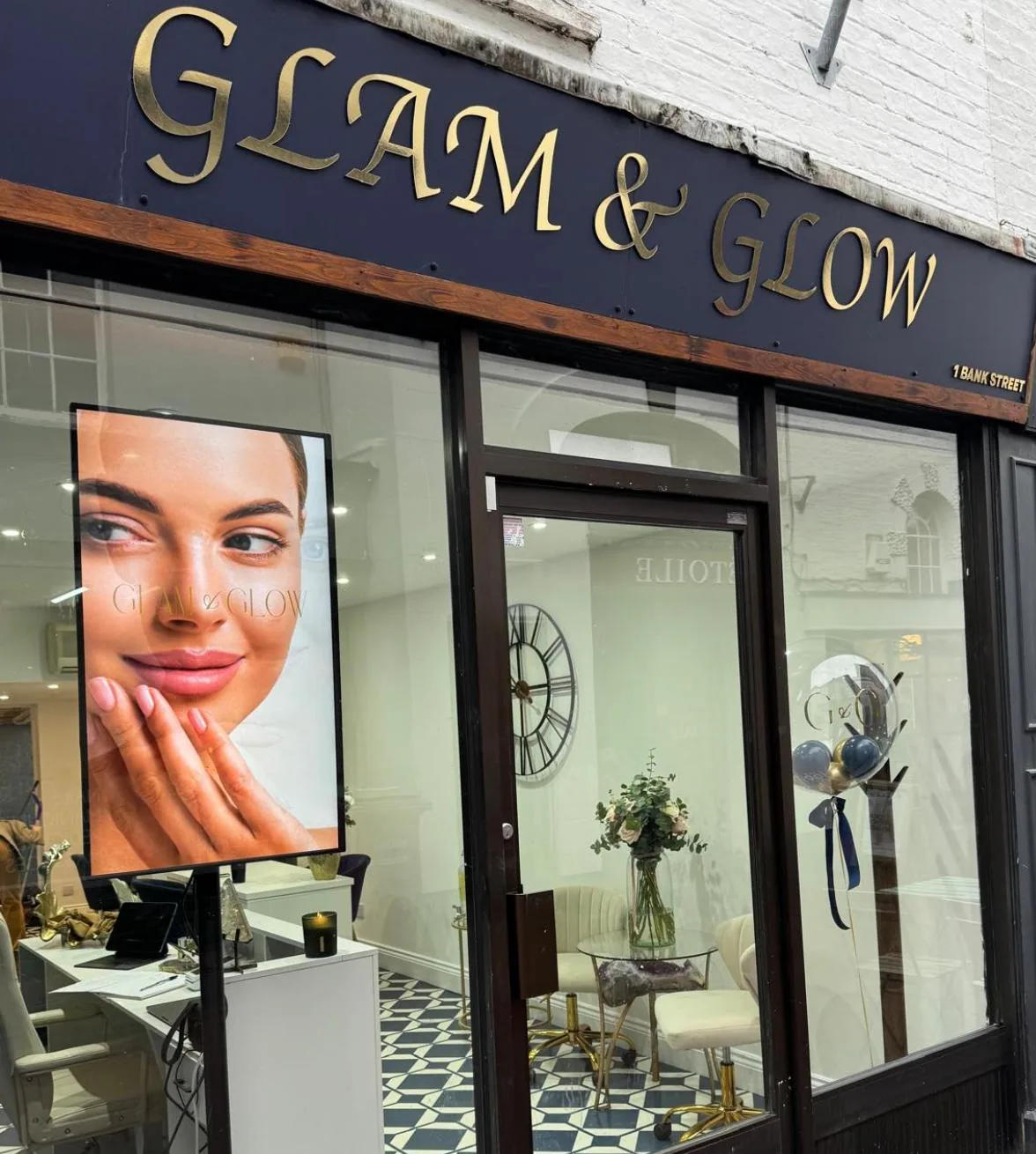 Glam & Glow storefront on 1 Bank Street Sevenoaks — navy facade with gold serif lettering